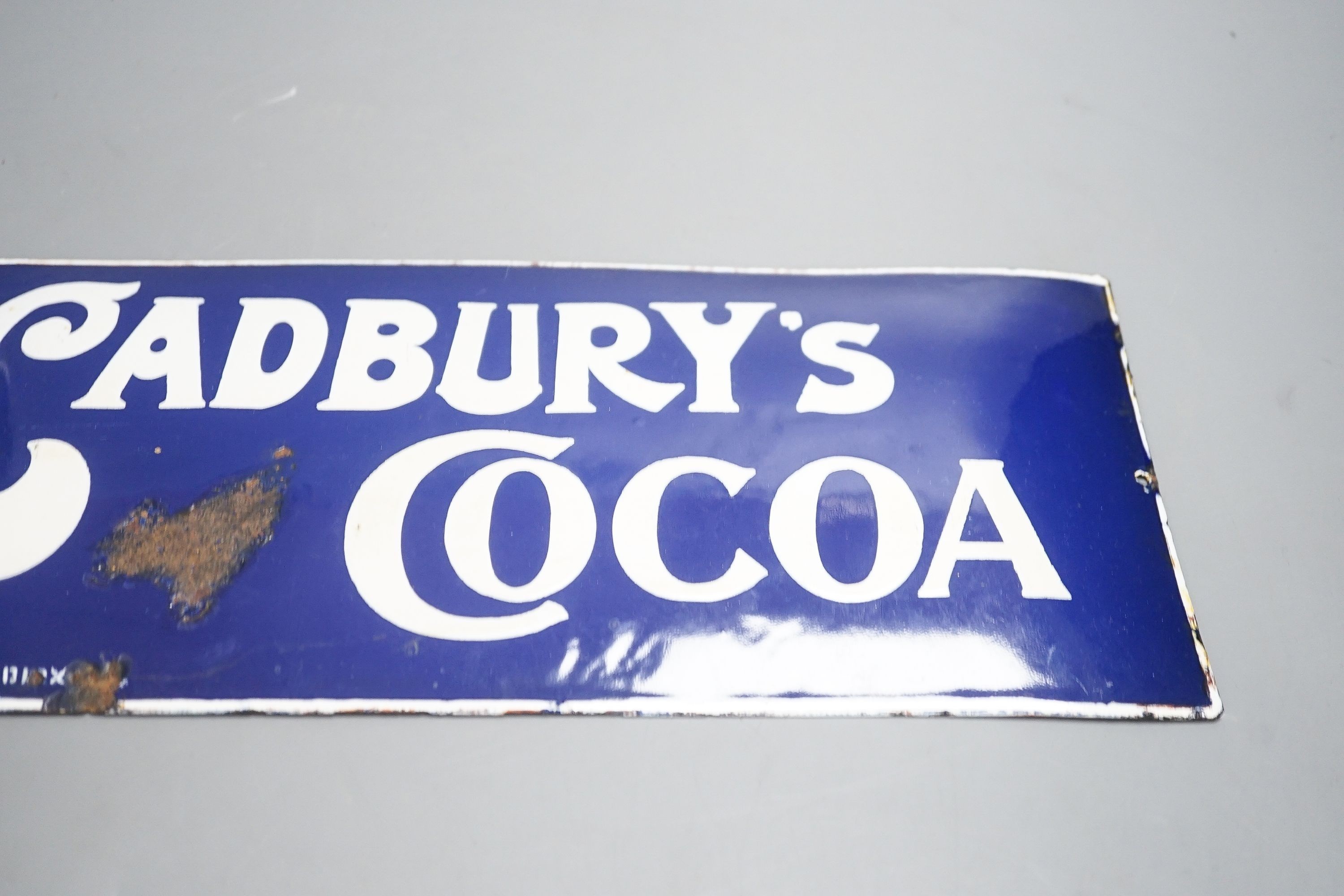 A Cadburys cocoa advertising enamel sign 15x35cm